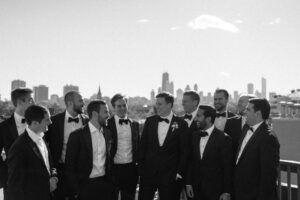 chicago wedding photographer fun with groomsmen on rooftop