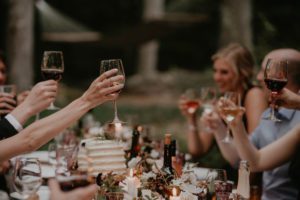 Door County micro backyard wedding vintage Wisconsin cheers dinner