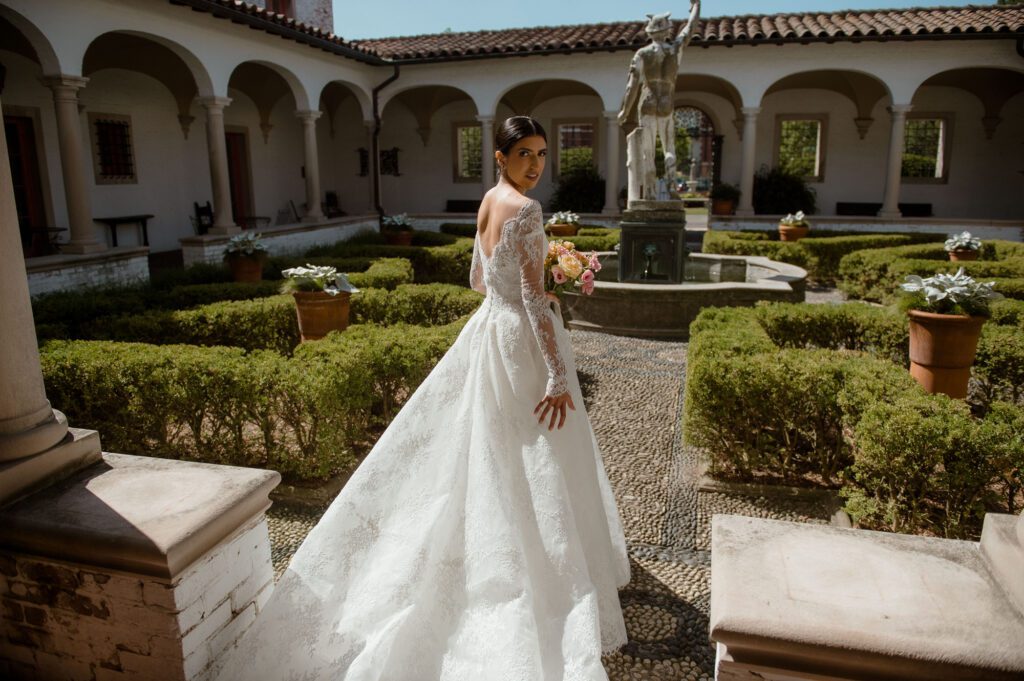 Bride in courtyard of Villa Terrace Wisconsin summer wedding