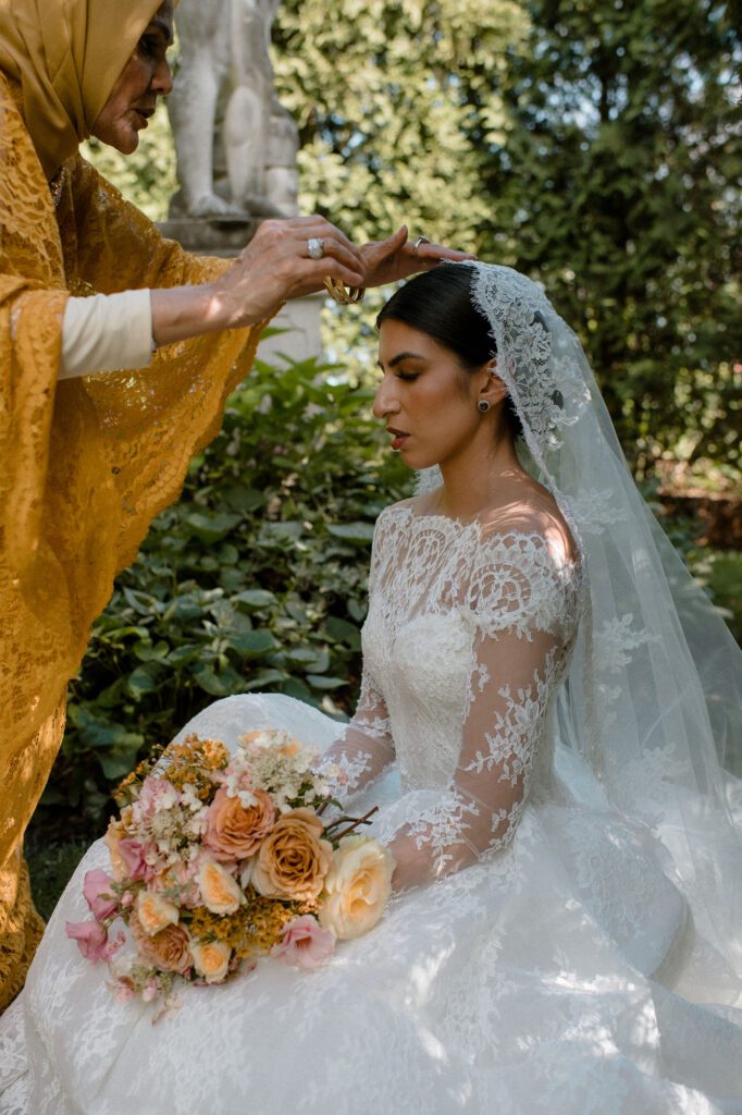 Bride in garden of Villa Terrace wedding venue in Milwaukee