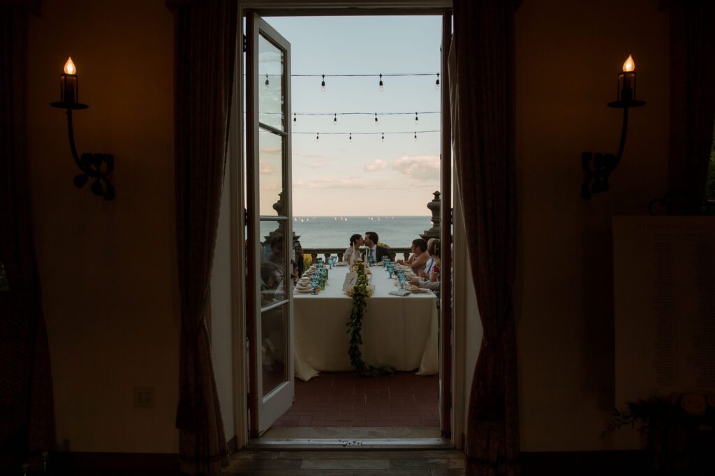 dinner view of couple kissing at Villa Terrace Wisconsin wedding