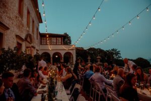 Villa Terrace Milwaukee wedding Wisconsin dinner on terrace at night string lights
