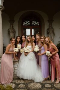 Bride having fun with her bridesmaids at Villa Terrace wedding in Milwaukee, Wisconsin.