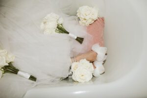 Bride has fun in bathtub at Villa Terrace Milwaukee Wisconsin