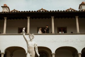 Wedding couple gives speech and exchange vows on balcony at Villa Terrace in Milwaukee, Wisconsin