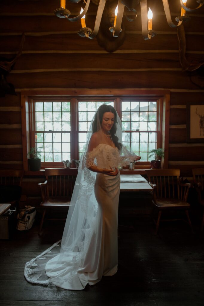 Bride in veil and wedding gown at River Wildlife