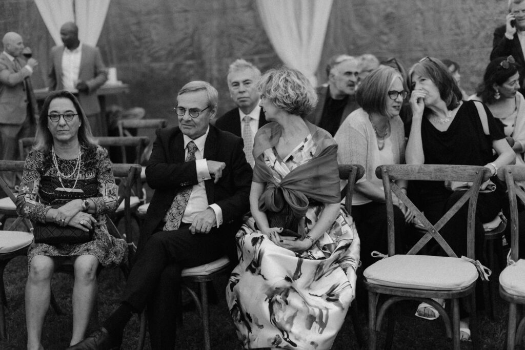 Guests sitting at wedding ceremony in Wisconsin at River Wildlife