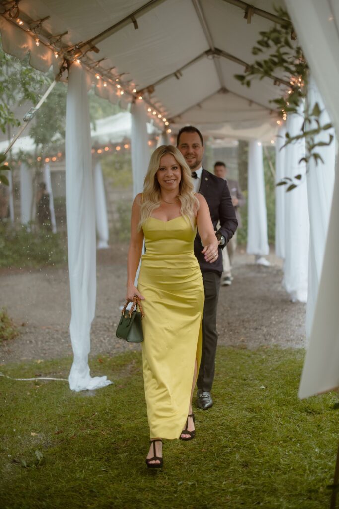 Guests arriving to outdoor tent wedding at River Wildlife in Kohler, Wisconsin