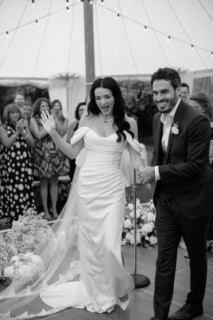 Bride and groom smile as they exit their wedding ceremony at River Wildlife