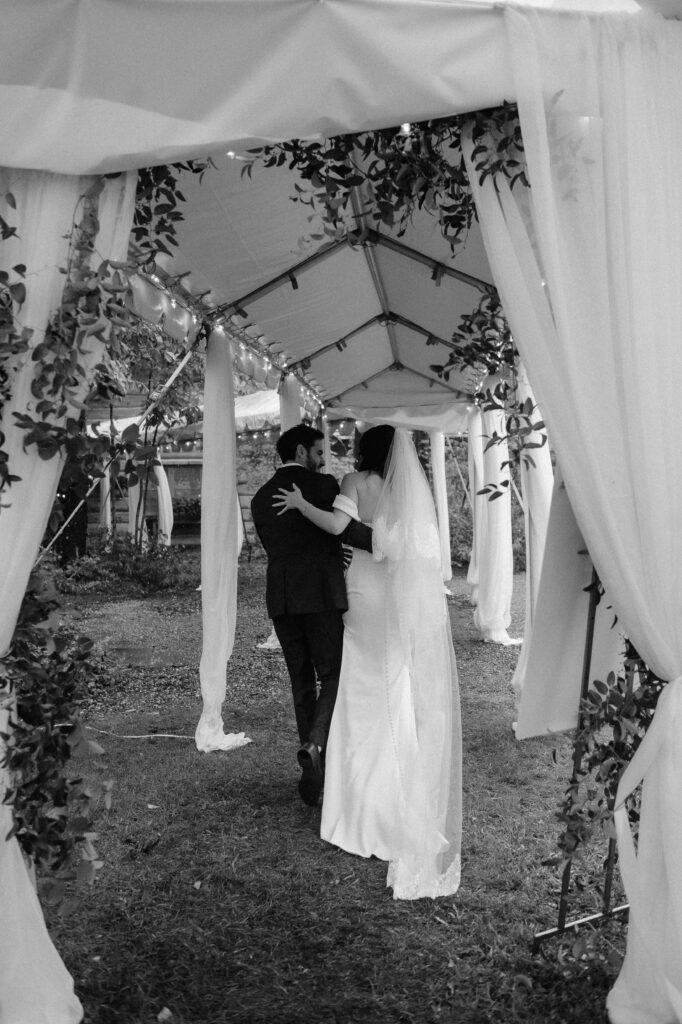 Bride and groom exit their tent wedding reception at American Club in Kohler