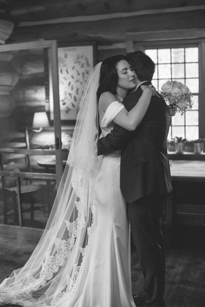 Bride and groom embrace at American Club in Kohler
