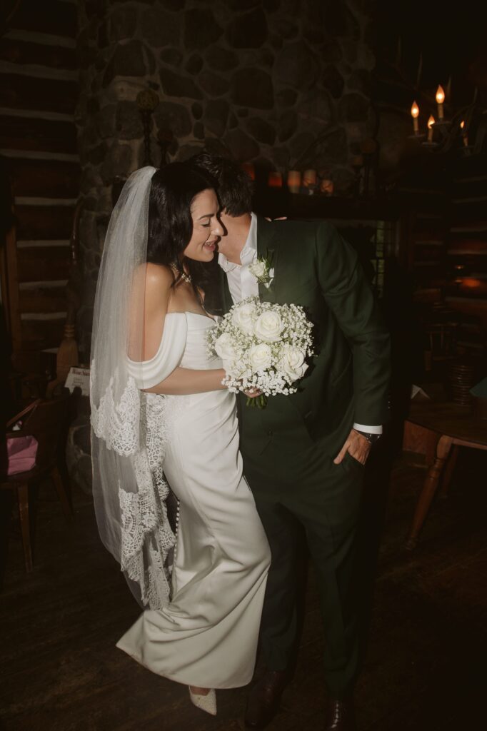 Bride and groom embrace at wedding at River Wildlife