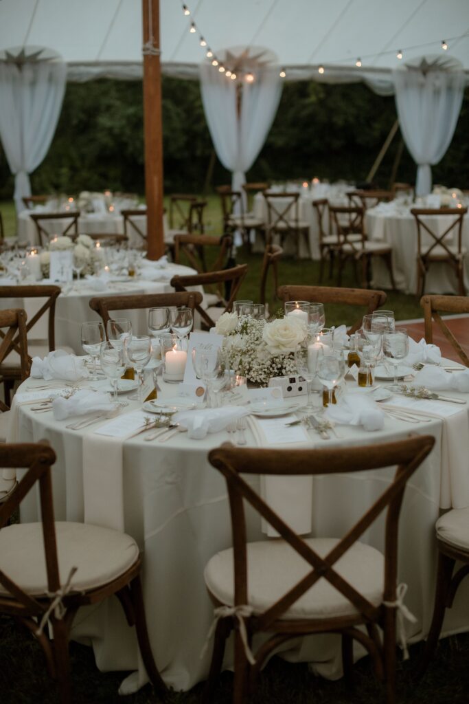 Wedding tables at tent reception in Kohler