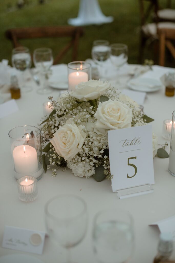 Wedding table centerpiece at outdoor River Wildlife wedding reception