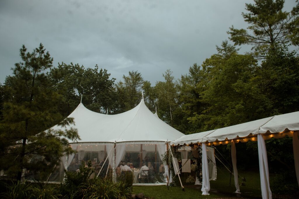 Wedding reception tent under cloudy skies in Kohler, WI at River Wildlife