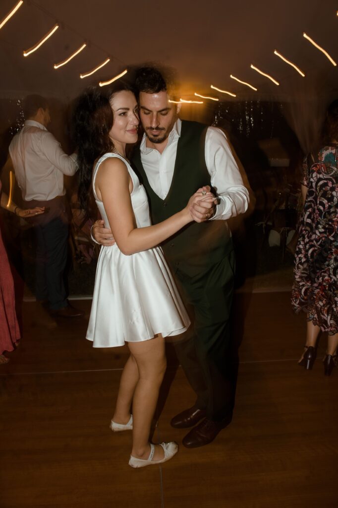 Bride and groom dance at River Wildlife wedding reception