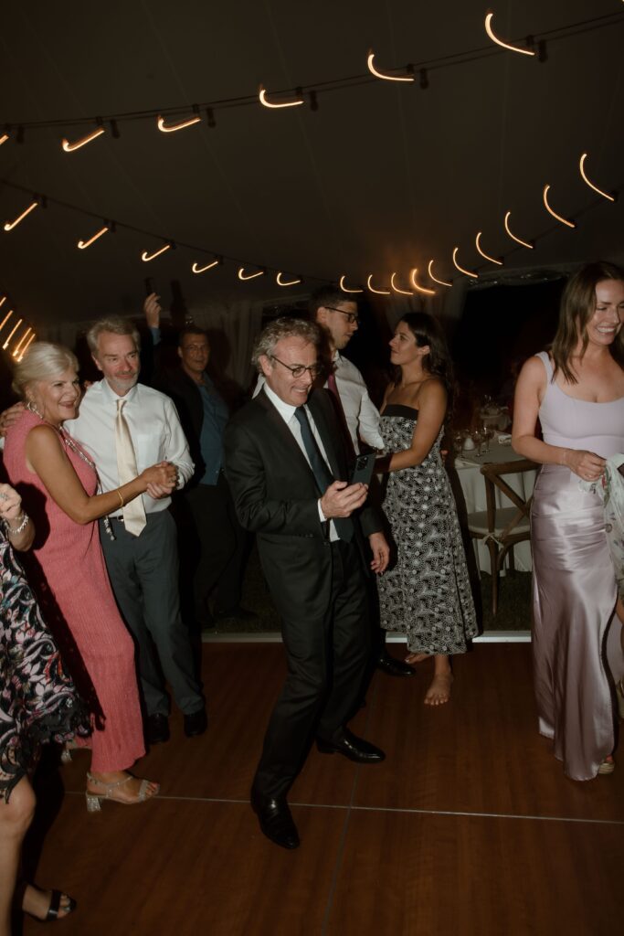 Guests dance at River Wildlife wedding reception