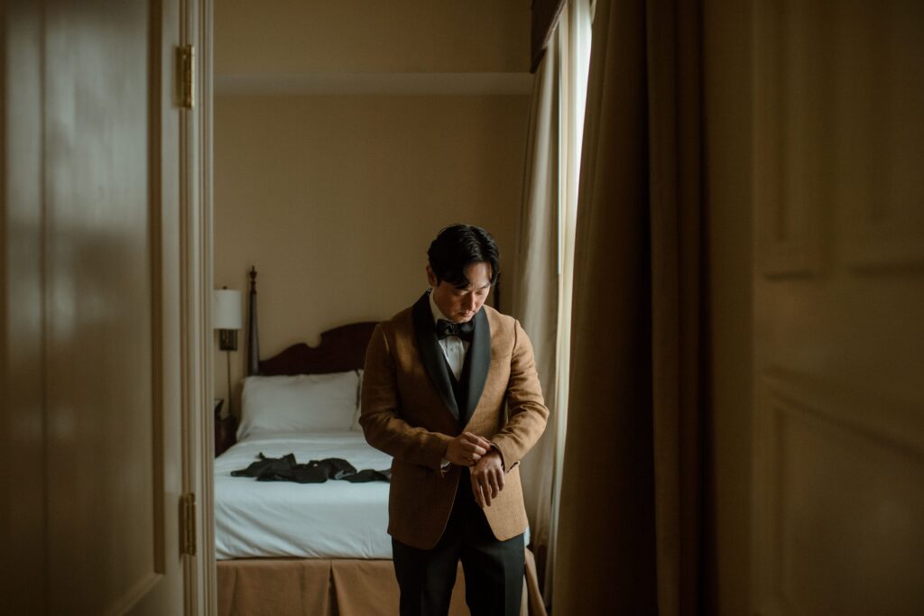 Groom getting ready before the wedding at Pfister Hotel in Milwaukee