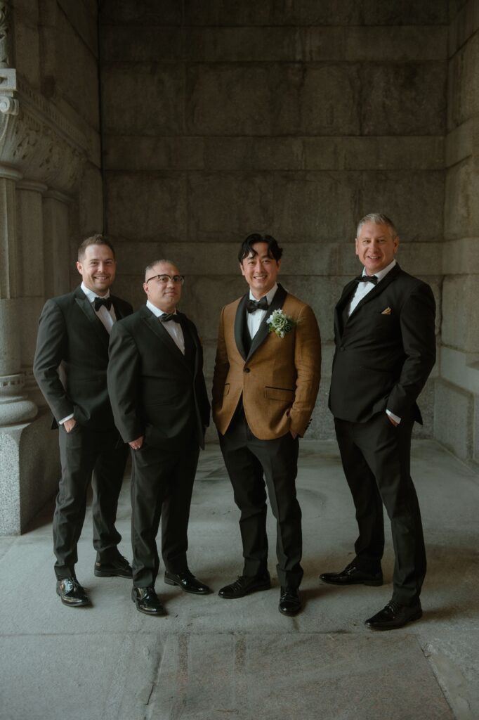 Groom and his groomsmen at Pfister Hotel in Milwaukee