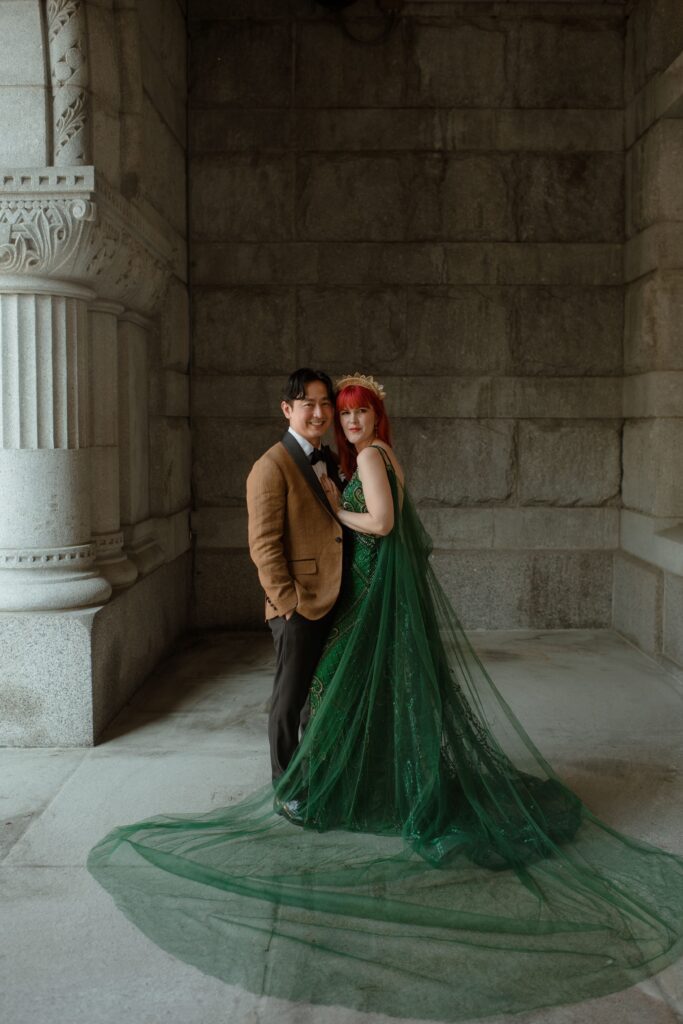 Wedding couple pose together outside the Pfister Hotel in Milwaukee