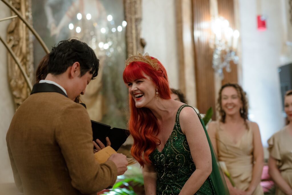 Bride laughing during vows at Pfister Hotel in Milwaukee