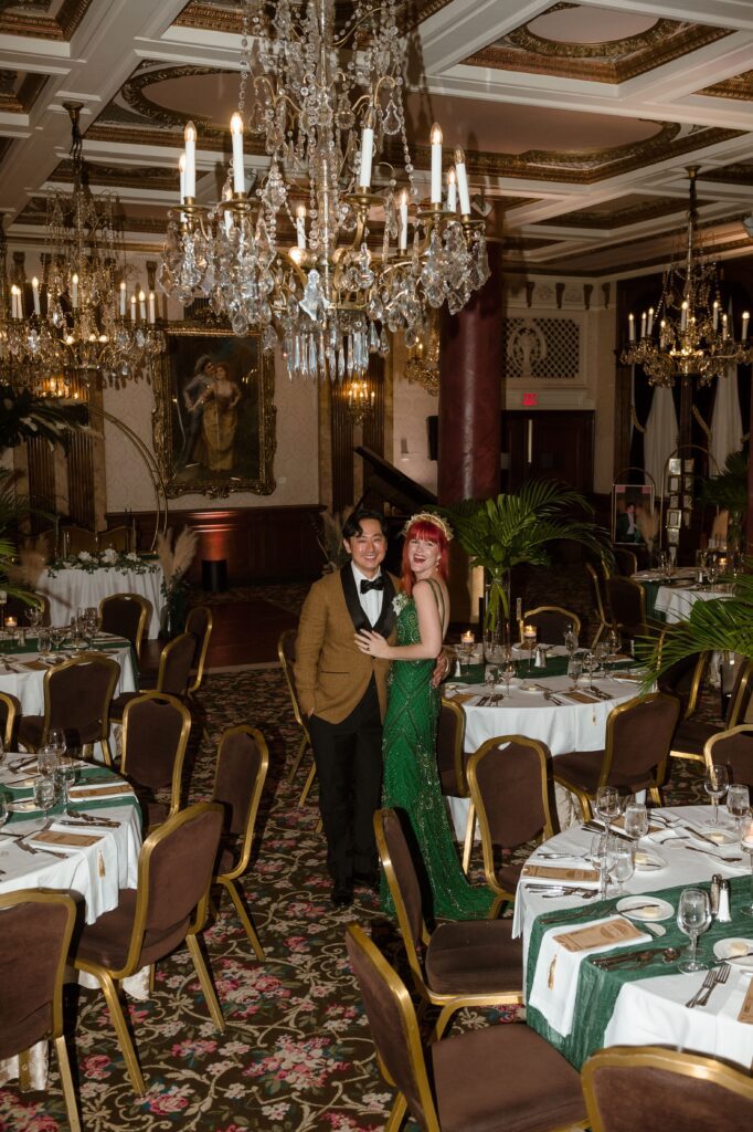 Bride and groom smile as they take in their wedding reception at the Pfister Hotel in Milwaukee