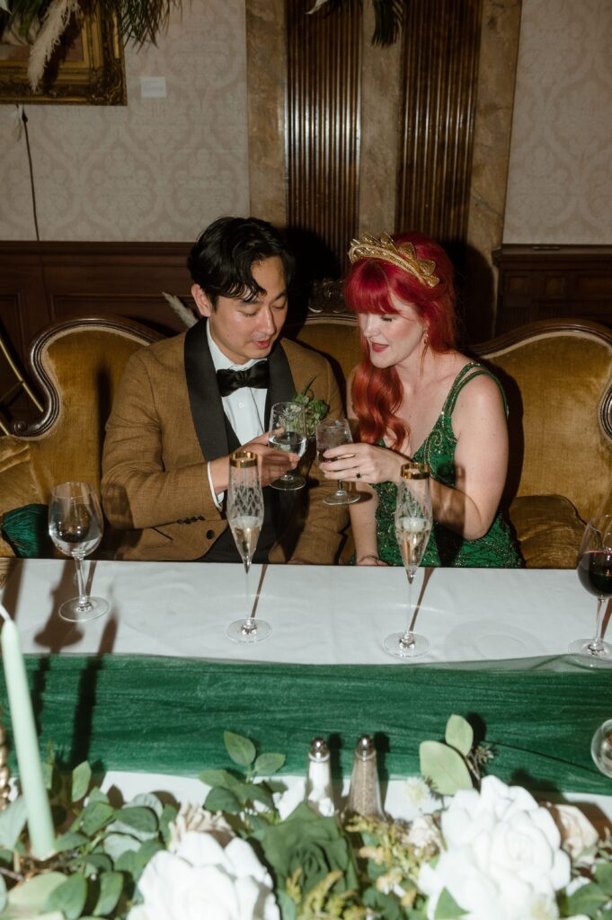 Bride and groom cheers at their wedding reception at the Pfister Hotel in Milwaukee