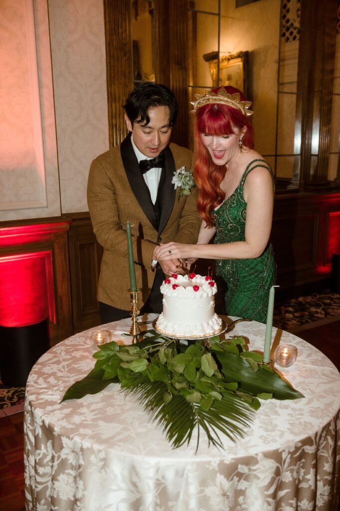Bride and groom cut their cake at the Pfister Hotel in Milwaukee