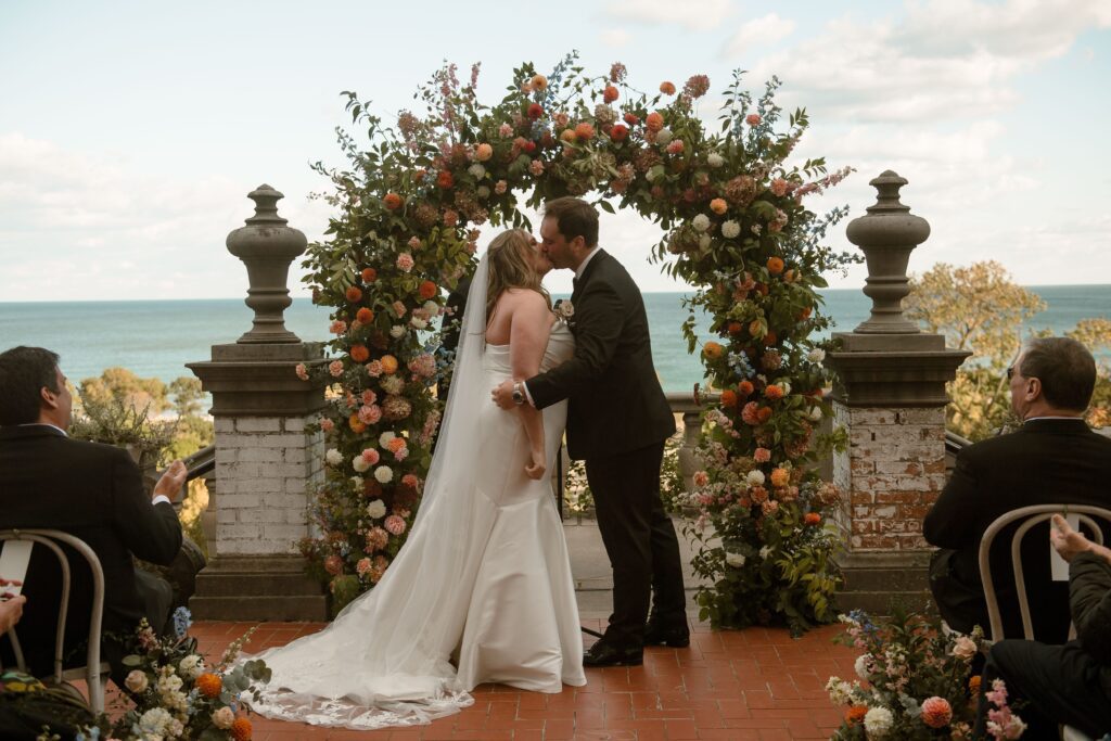 Couple's first kiss at Villa Terrace wedding ceremony