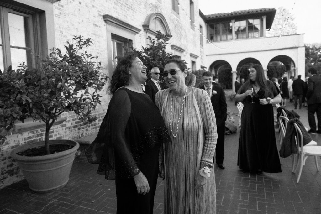 Guests mingling and laughing together at Villa Terrace wedding reception