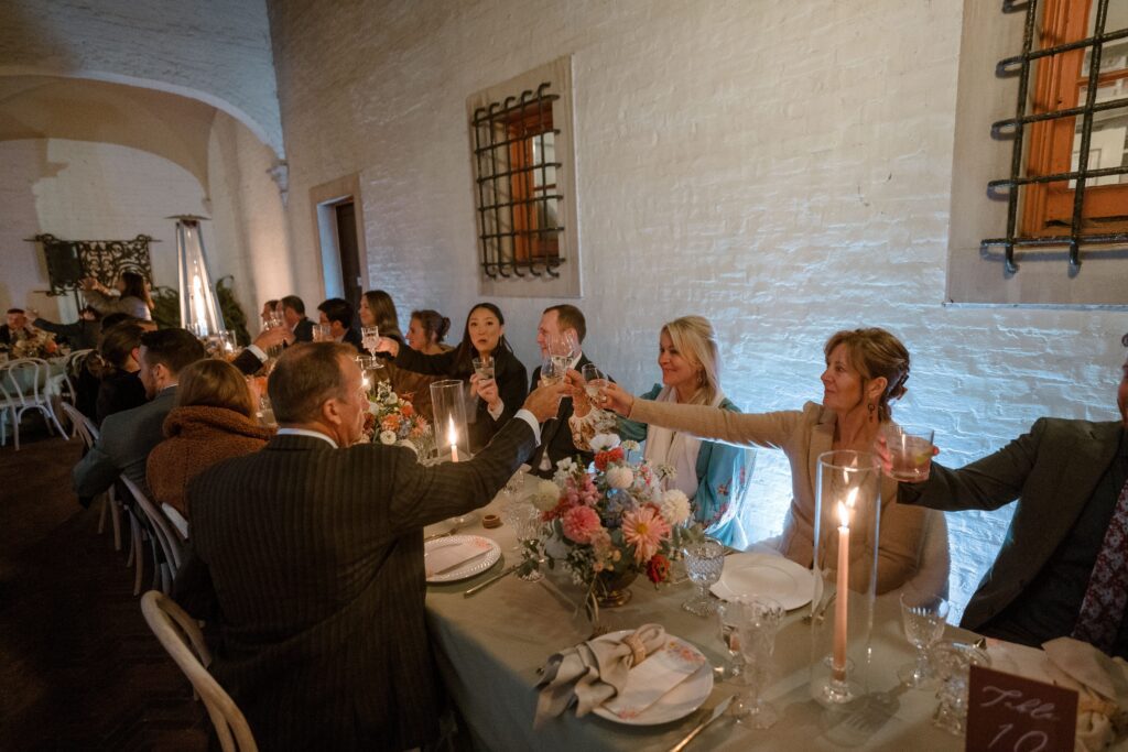 Guests toast at Villa Terrace wedding reception