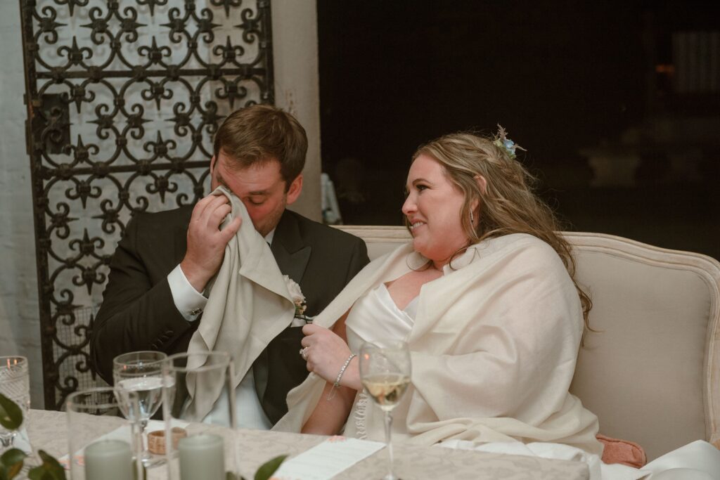Bride and groom cry at emotional toast