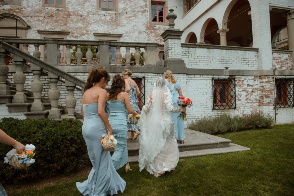 Bridal party walks up the steps at Villa Terrrace