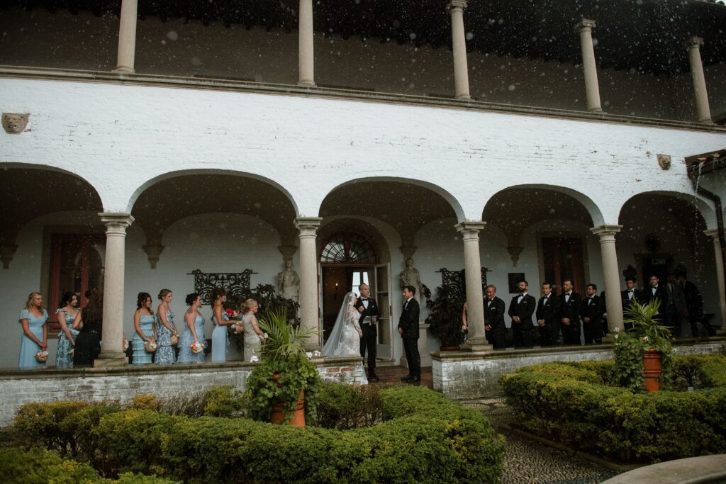 Wide shot of wedding ceremony in Villa Terrace Courtyard in Milwaukee