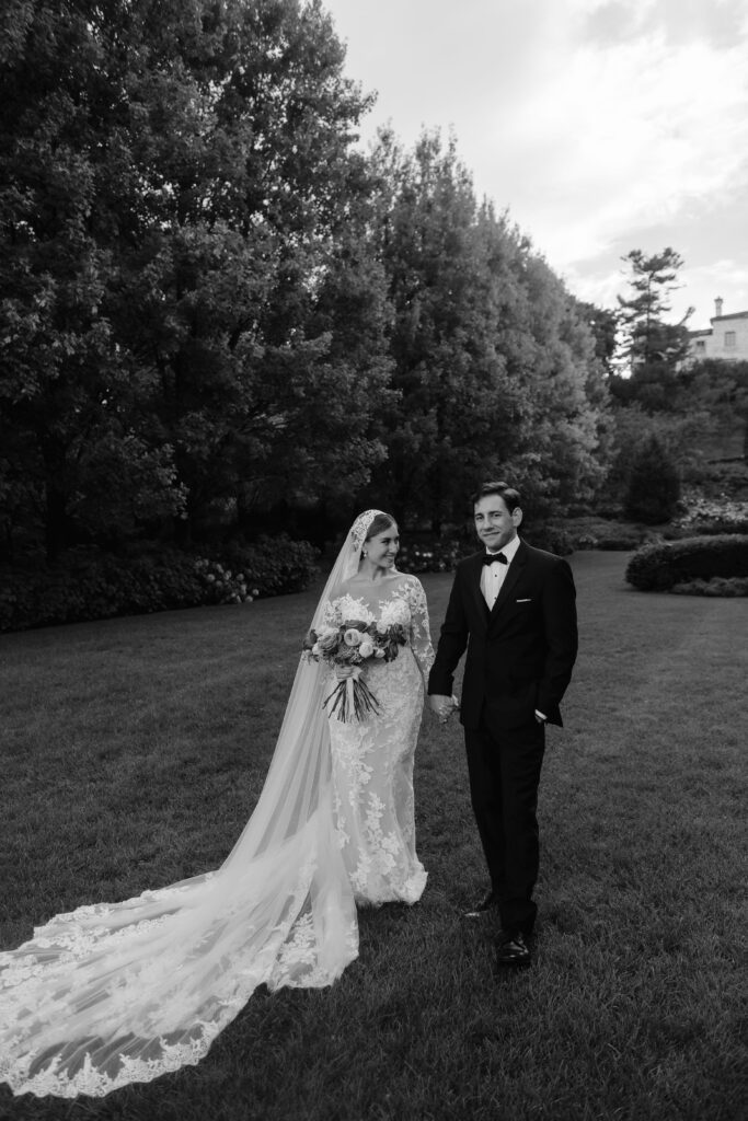 Villa Terrace wedding grounds with bride and groom holding hands