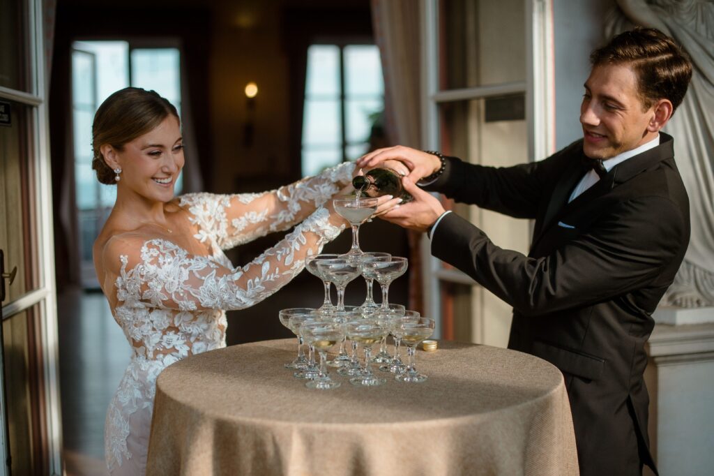 Wedding couple pour champagne