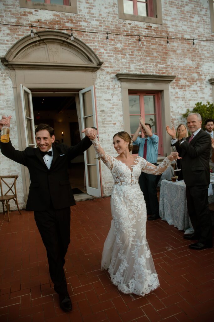 Bride and groom enter their reception at Villa Terrace