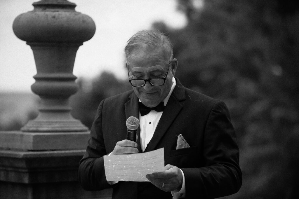Guest reads a speech at Villa Terrace wedding reception