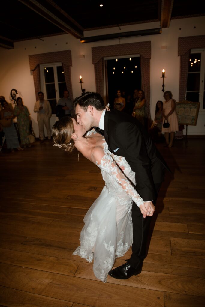 Bride and groom kiss after first dance at Villa Terrace in Milwaukee