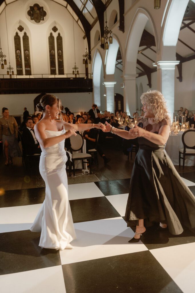 Bride and mother dance at St. James 1868 Milwaukee wedding venue