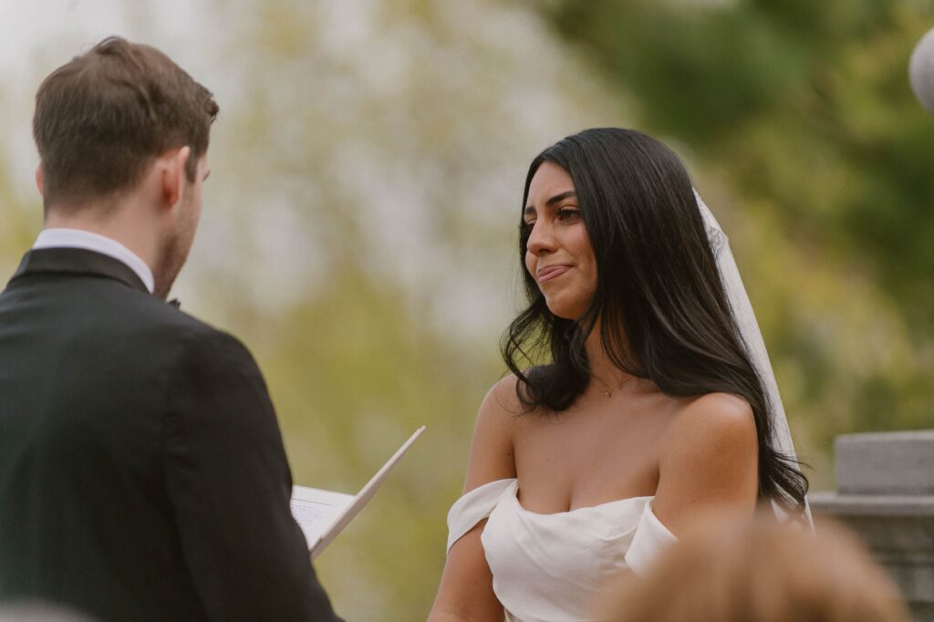Bride tears up during vows at Villa Terrace Milwaukee wedding ceremony